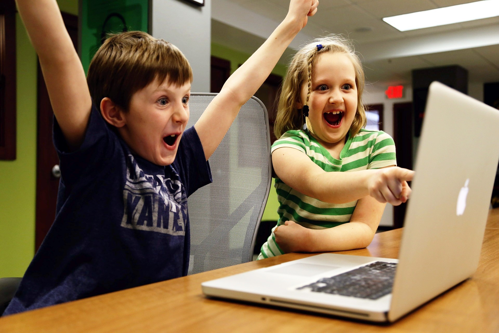 Children playing on a computer Children playing on a computer