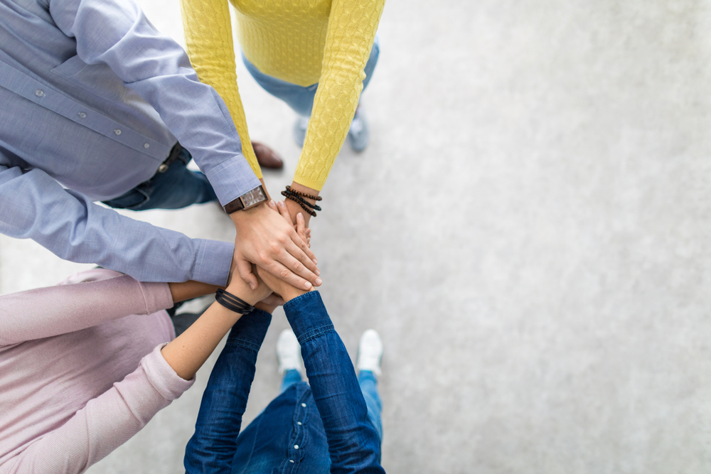 People shaking hands over web accessibility