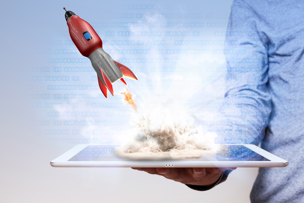 website launch - rocket coming out from a tablet screen
