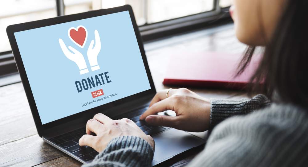 donation funnel website laptop screen showing a donation funnel